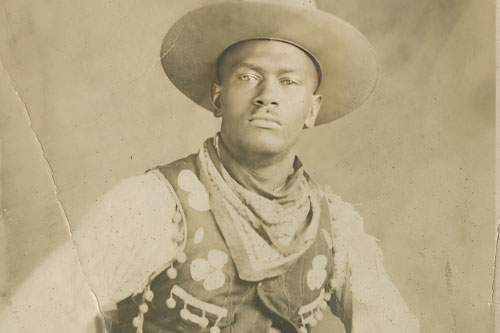 Black and white picture of an african american cowboy from the 19th century